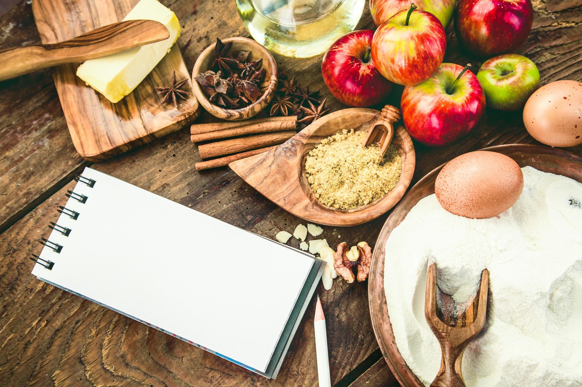 A workshop table with ingredients and notebooks